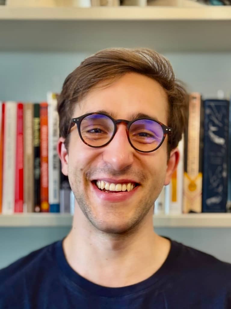 Alessandro smiling outdoors